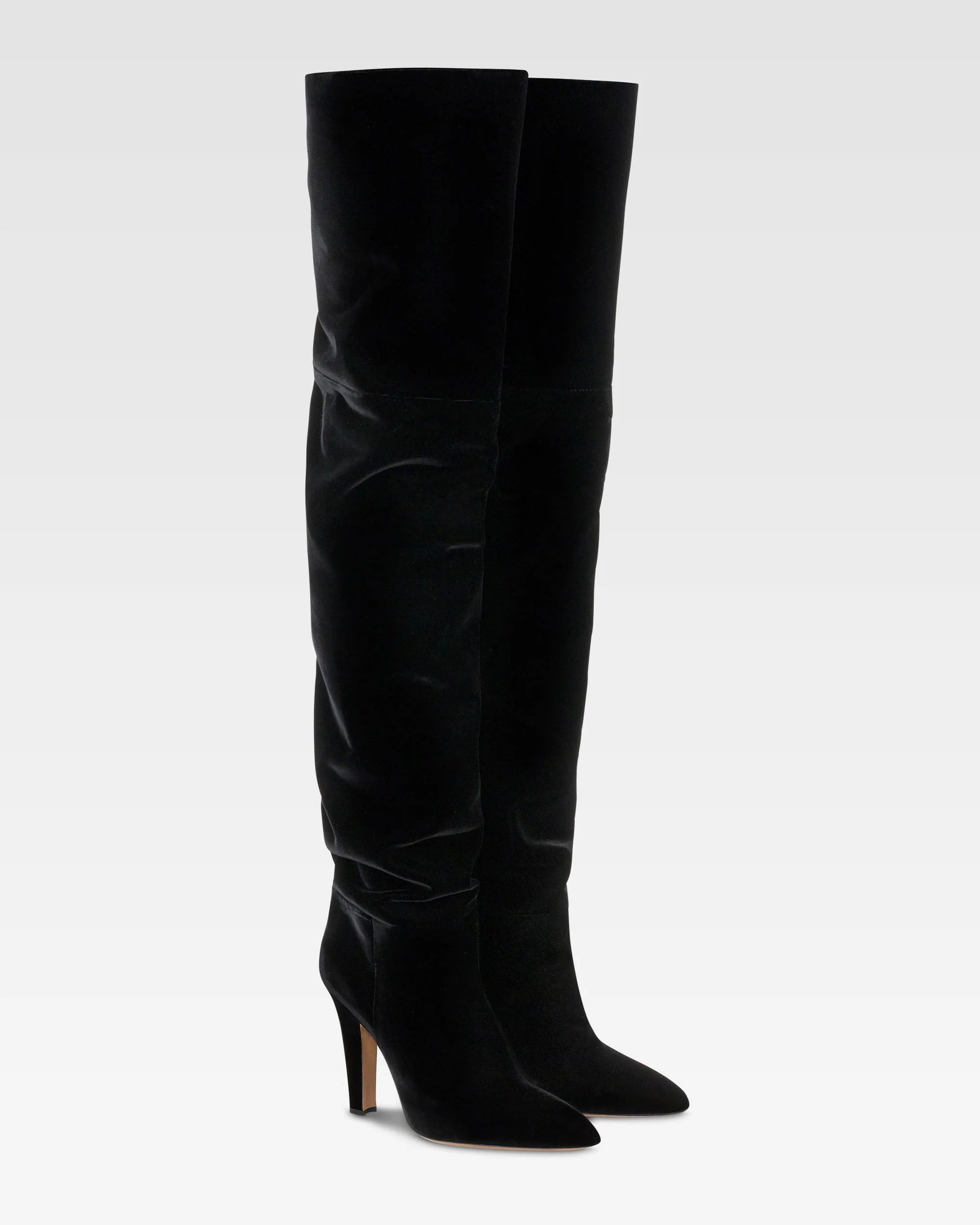 Over-the-knee boots in black velvet.