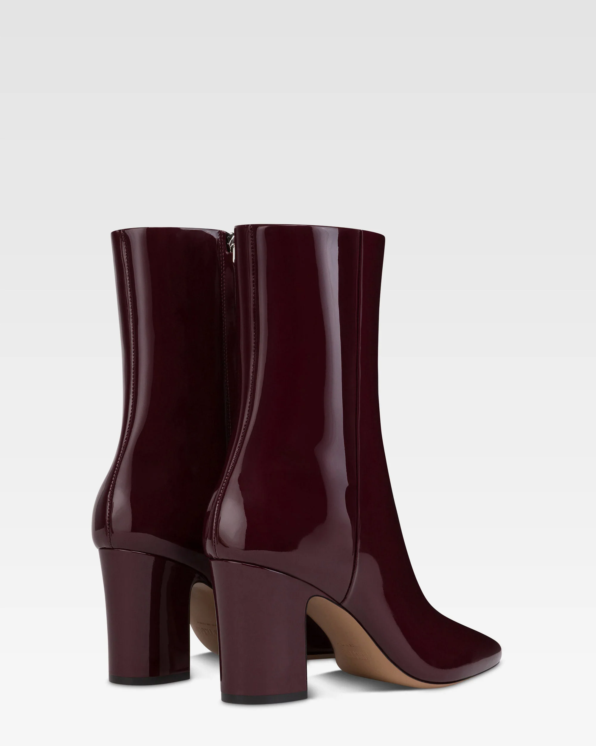 Ankle boots in rouge noir patent leather. 3 Ankle boots in rouge noir patent leather.