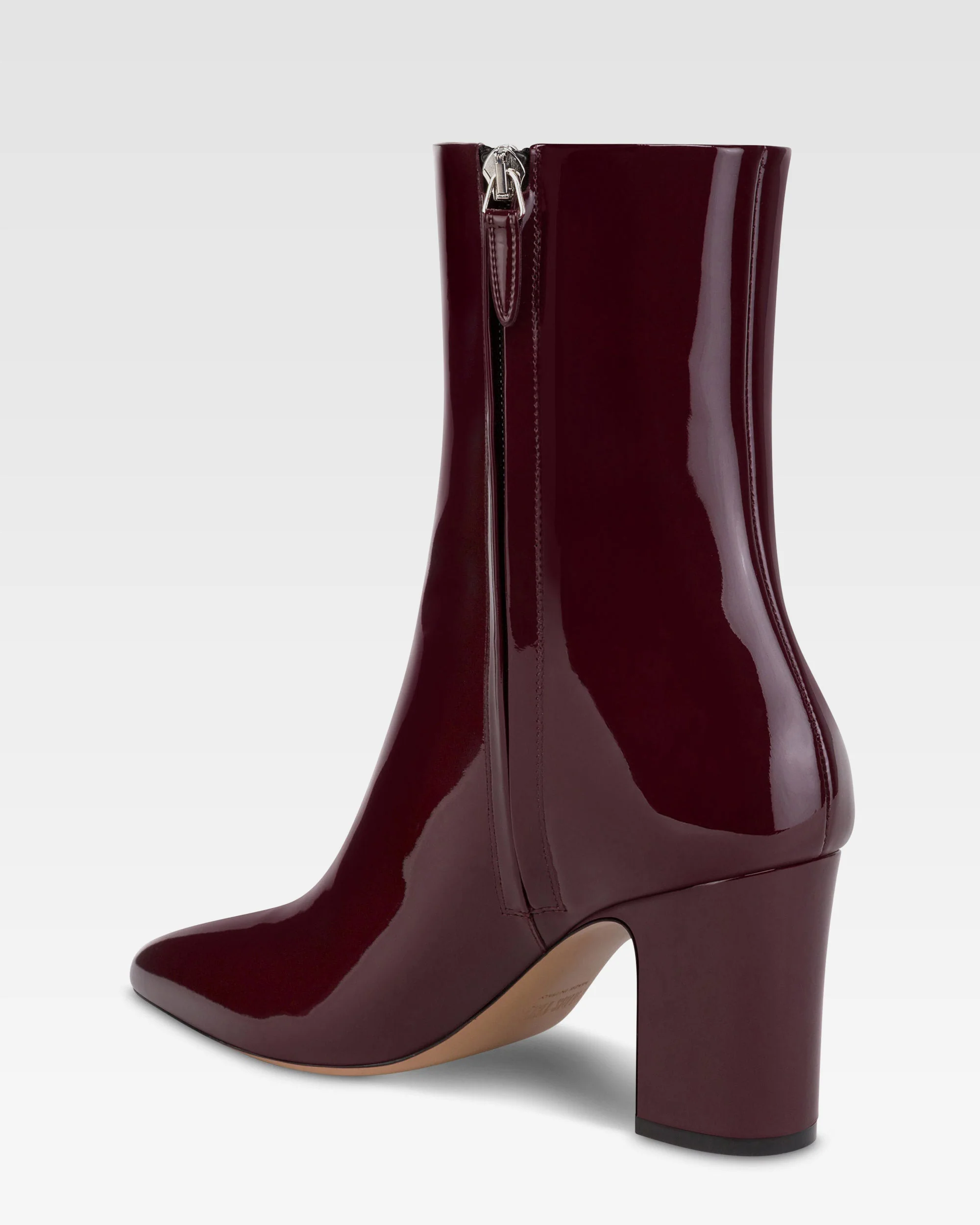 Ankle boots in rouge noir patent leather. 5 Ankle boots in rouge noir patent leather.