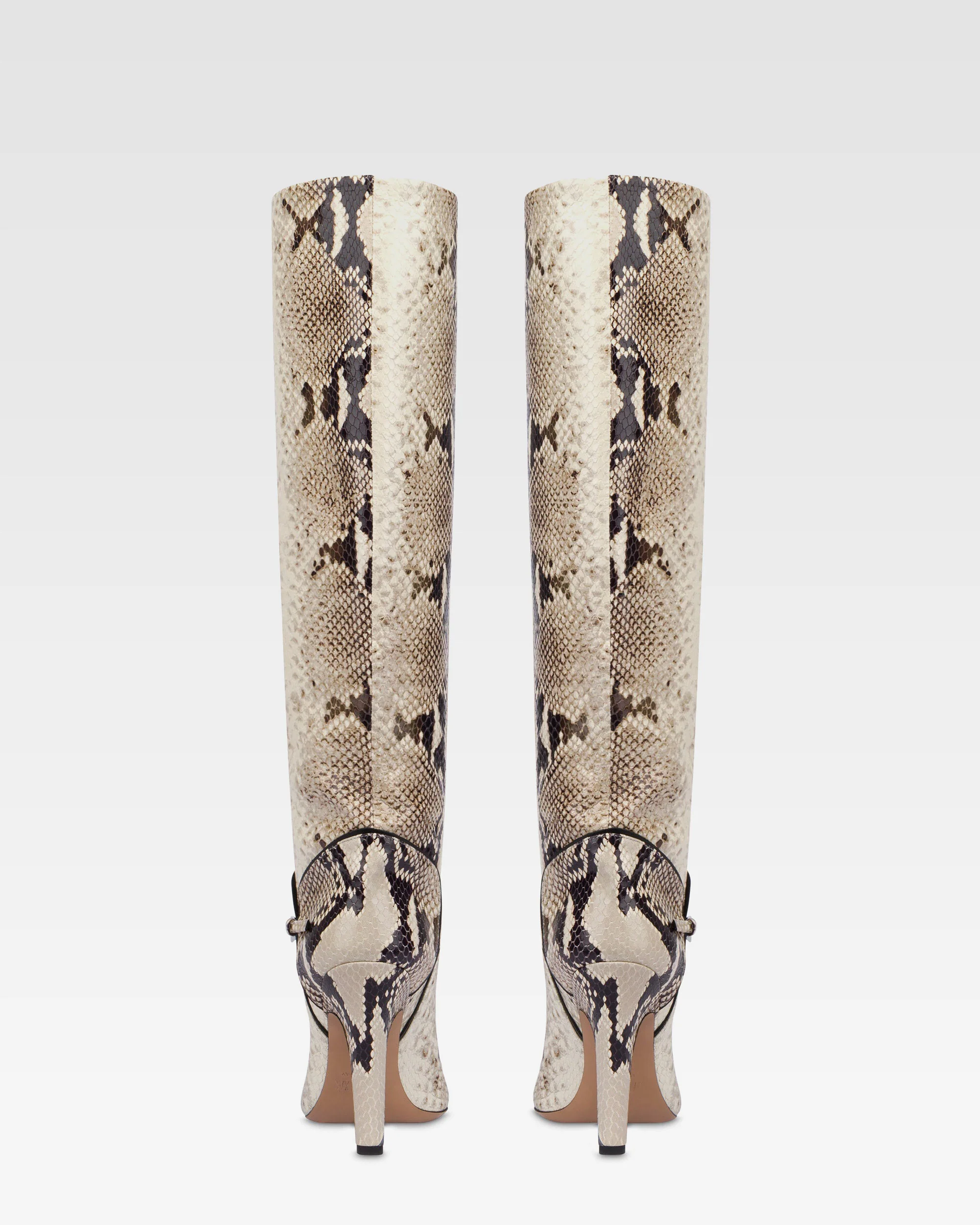 Boots in natural printed python leather.