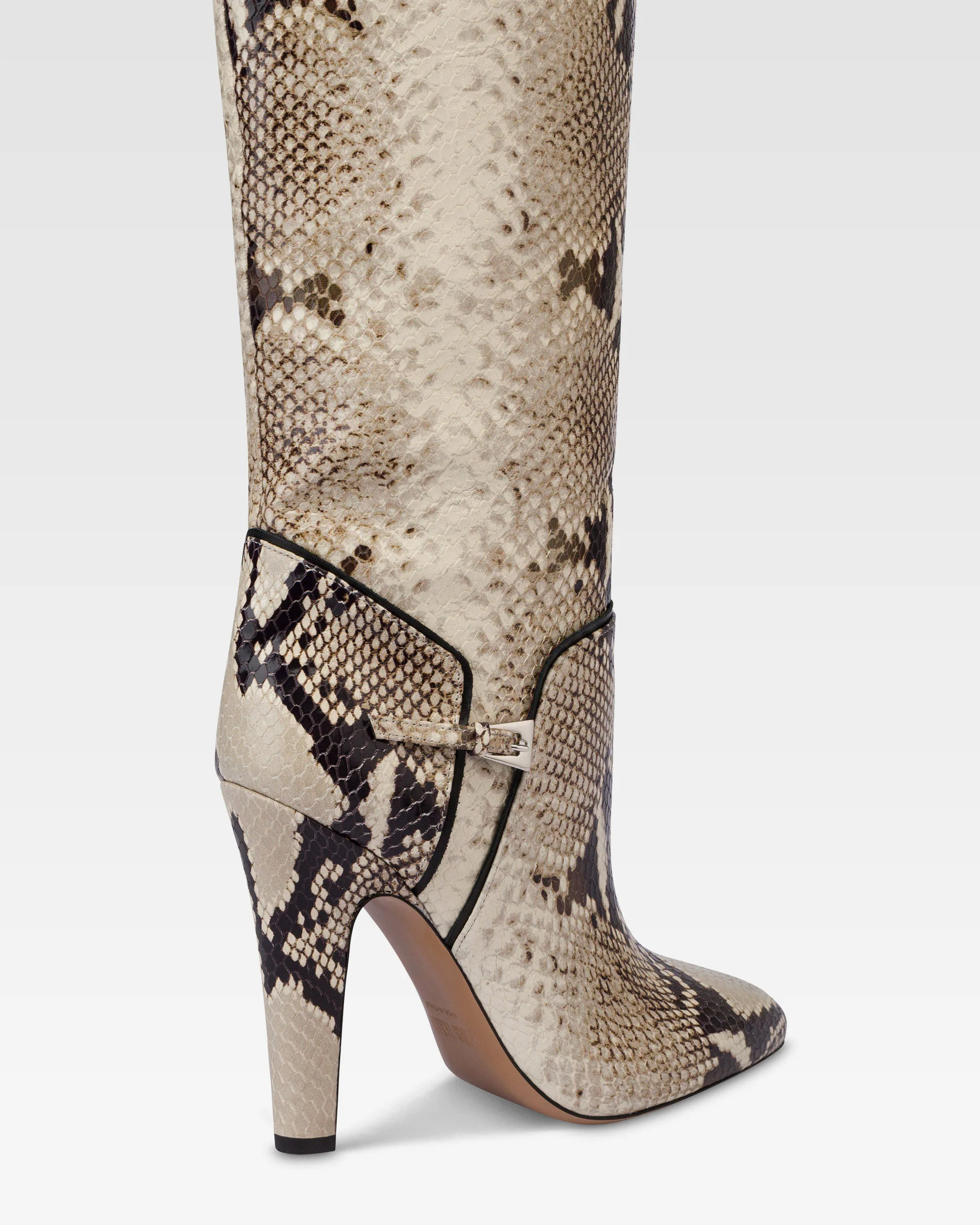 Boots in natural printed python leather.