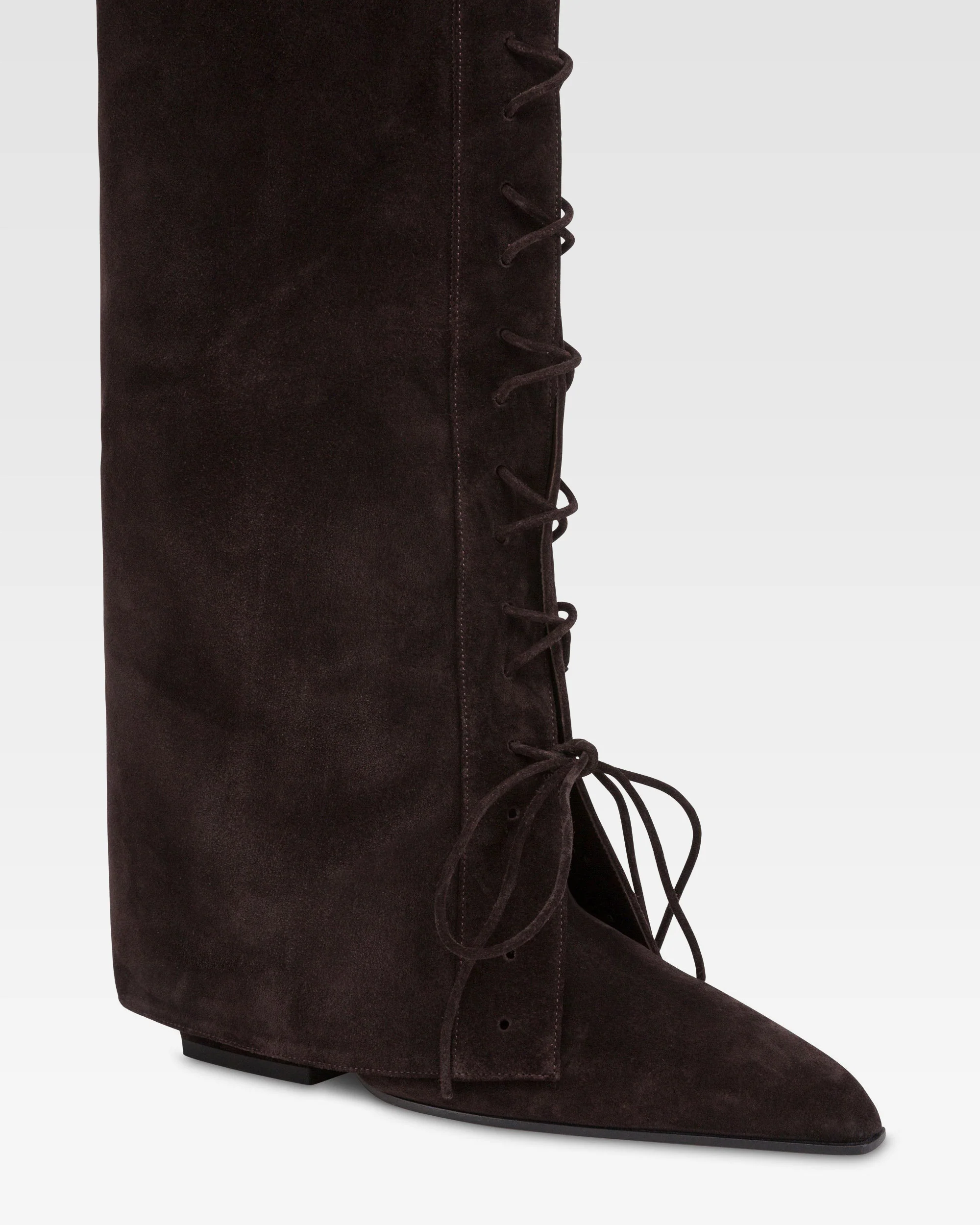 Fold-over boots in ebony calf suede. 5 Fold-over boots in ebony calf suede.