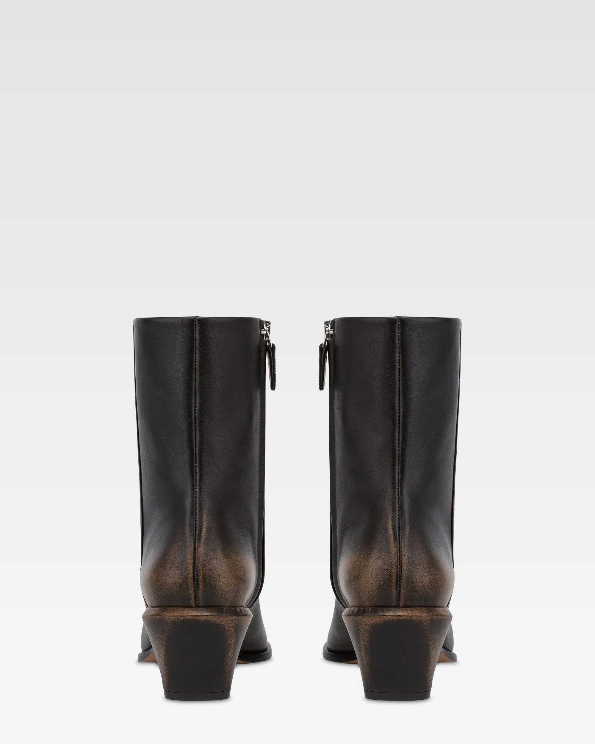 Ankle boots in black brushed leather.