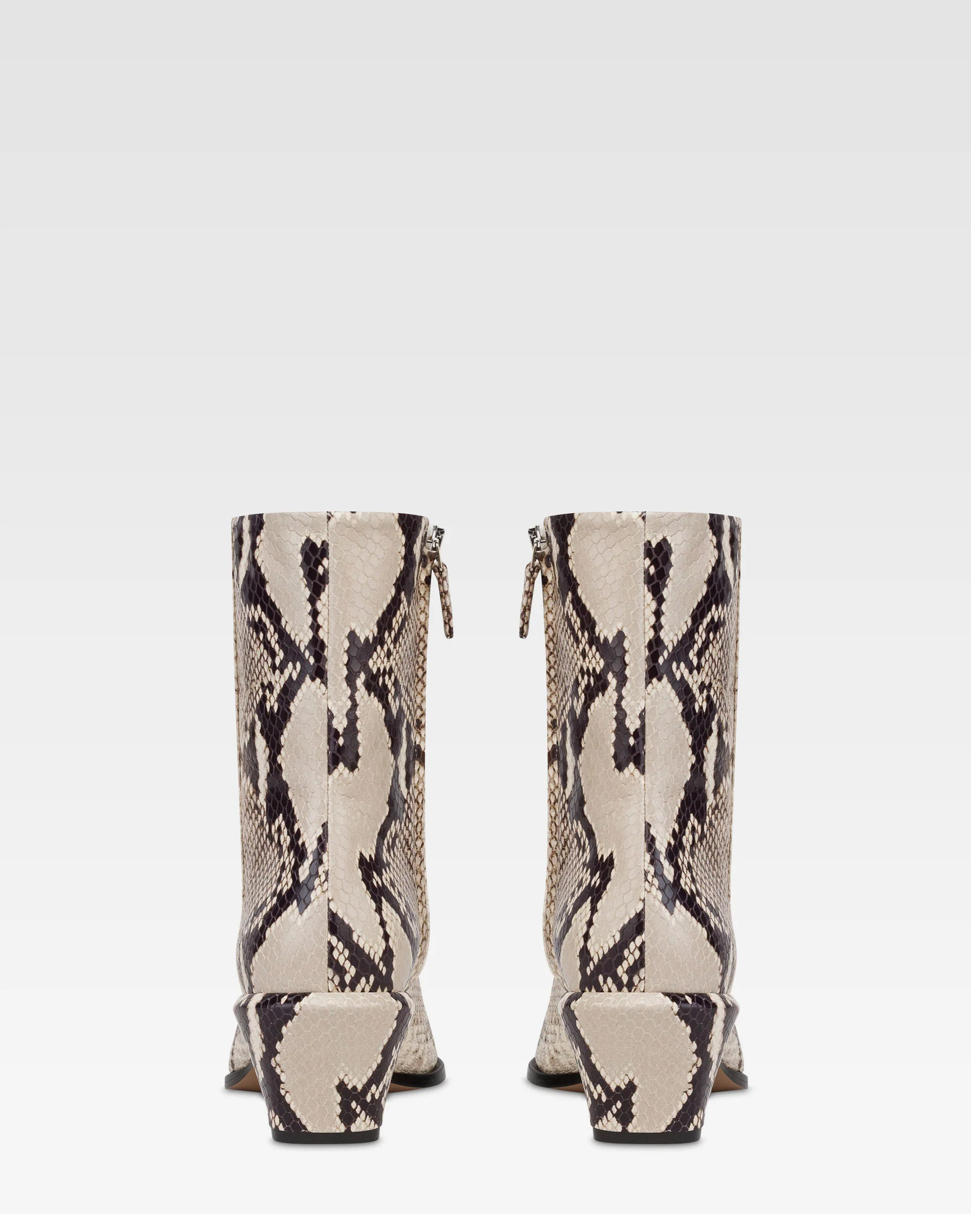 Ankle boots in natural printed python leather.