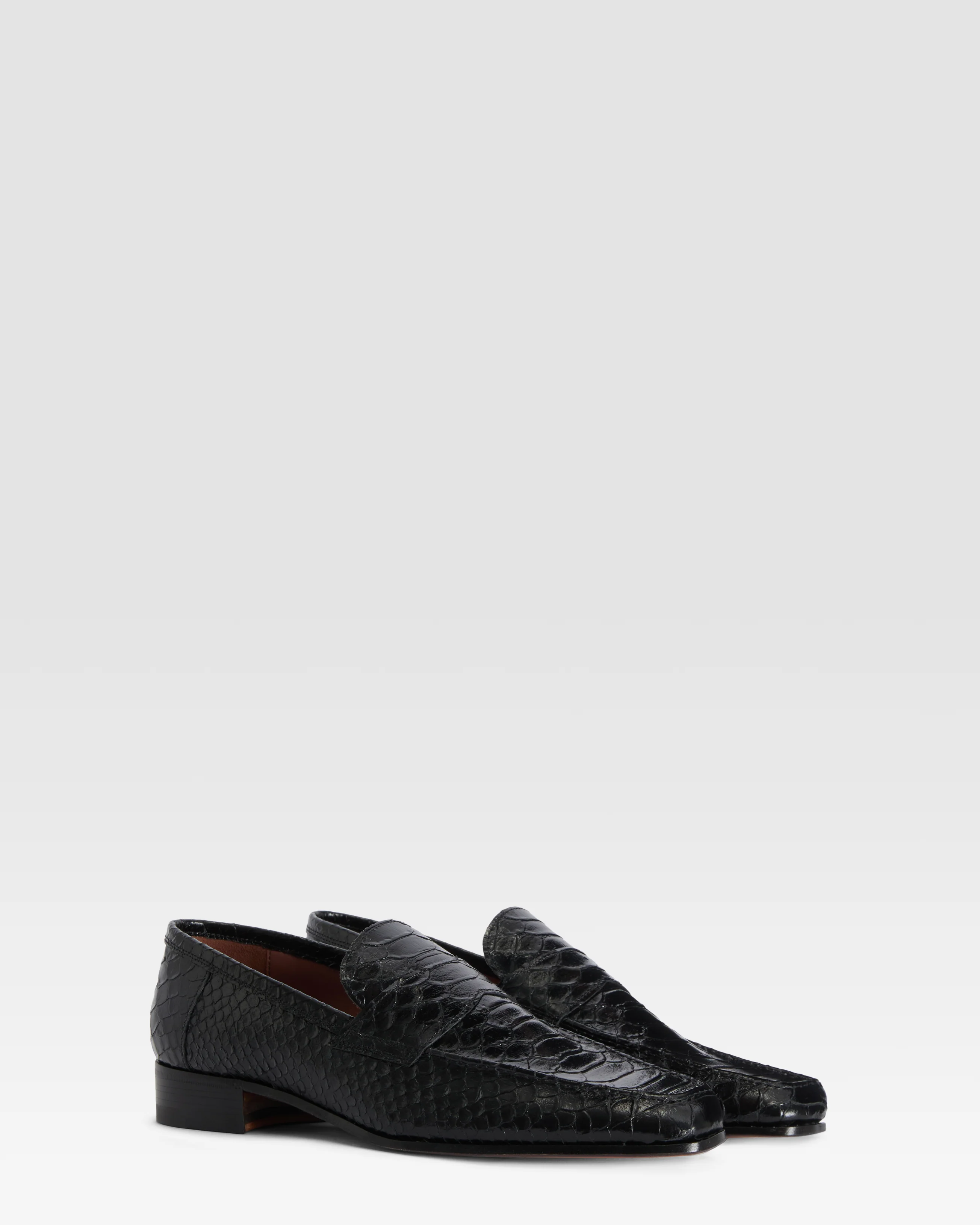 Loafers in black printed python leather