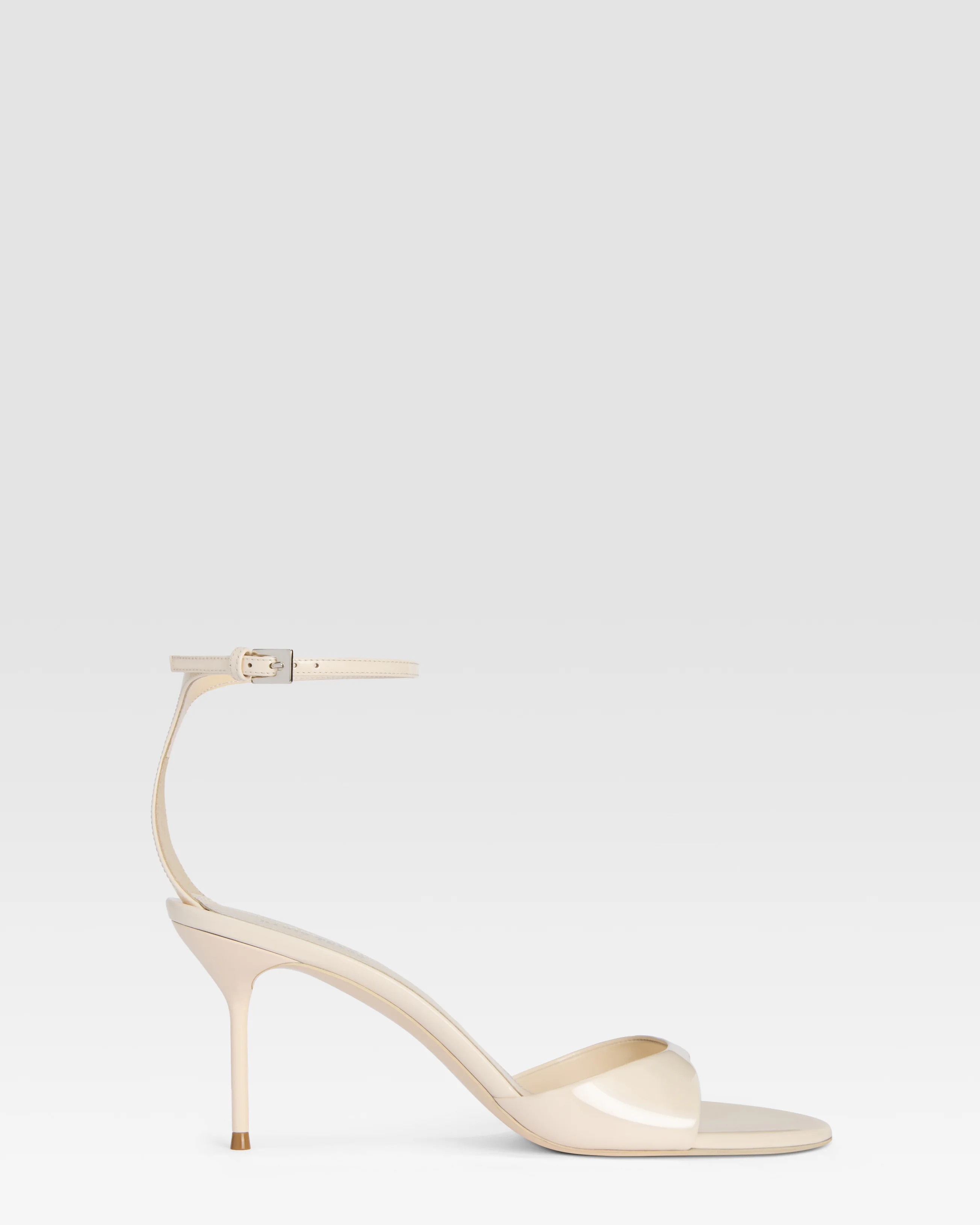 Ankle-strap sandals in ivory patent leather