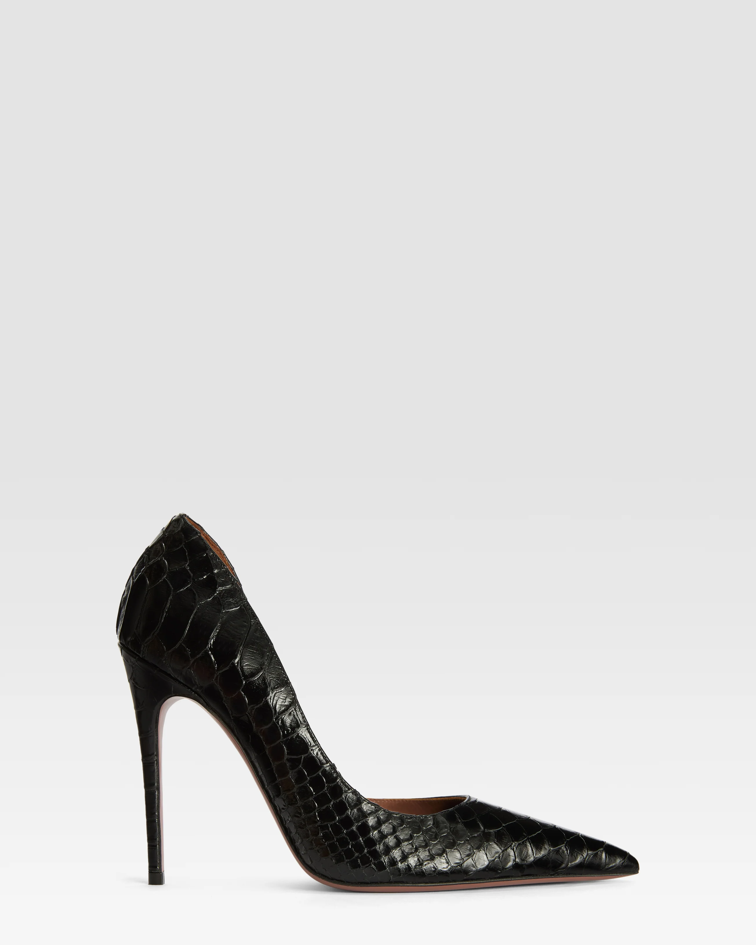 Pumps in black printed python leather