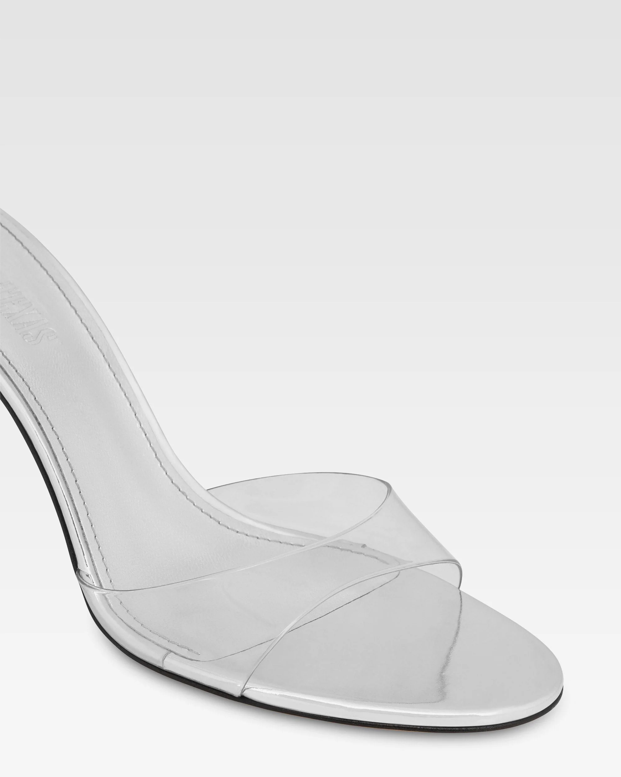 Almond-toe mules in supple silver PVC-mirror leather