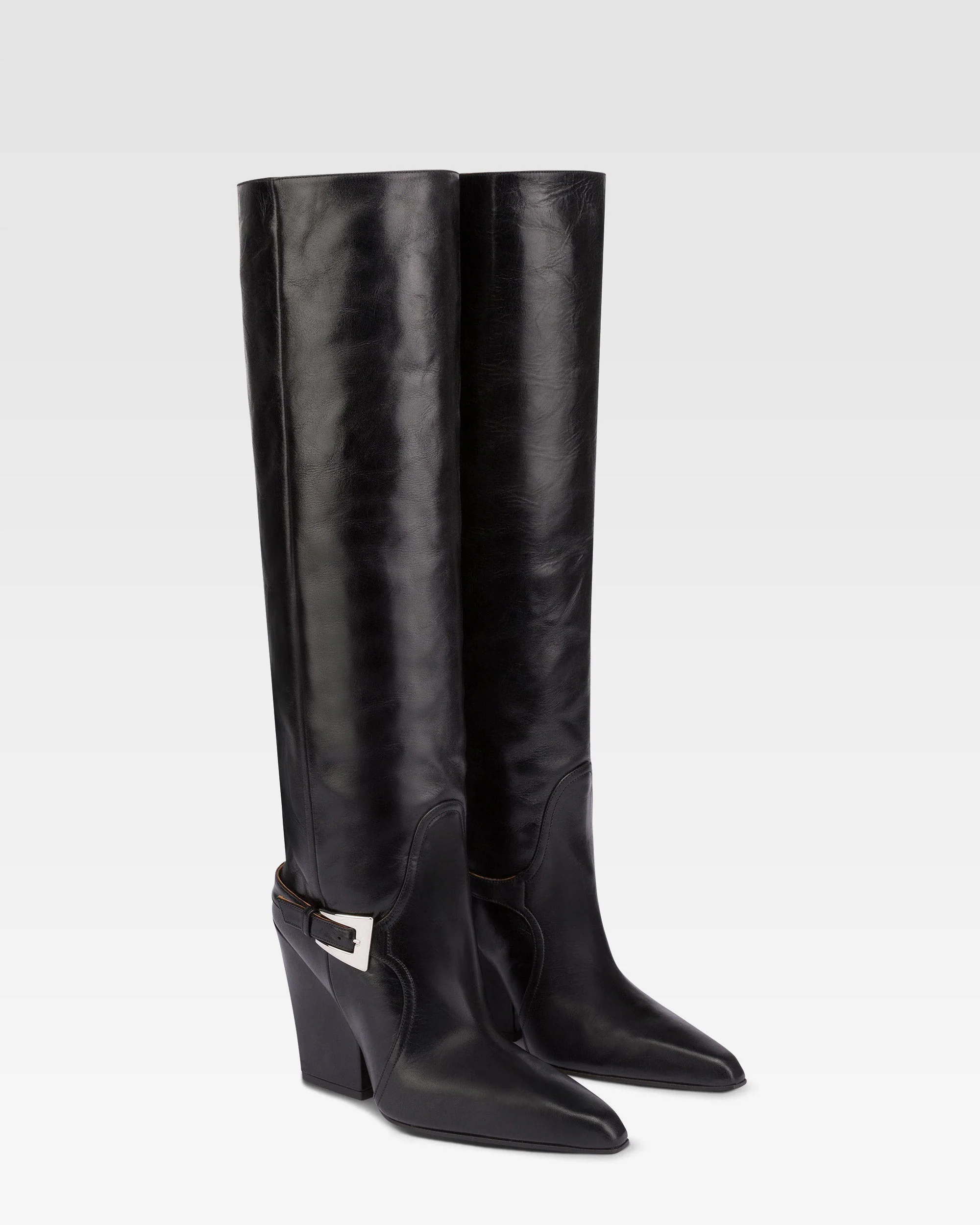 Tall, knee-high boots in shiny black vintage leather