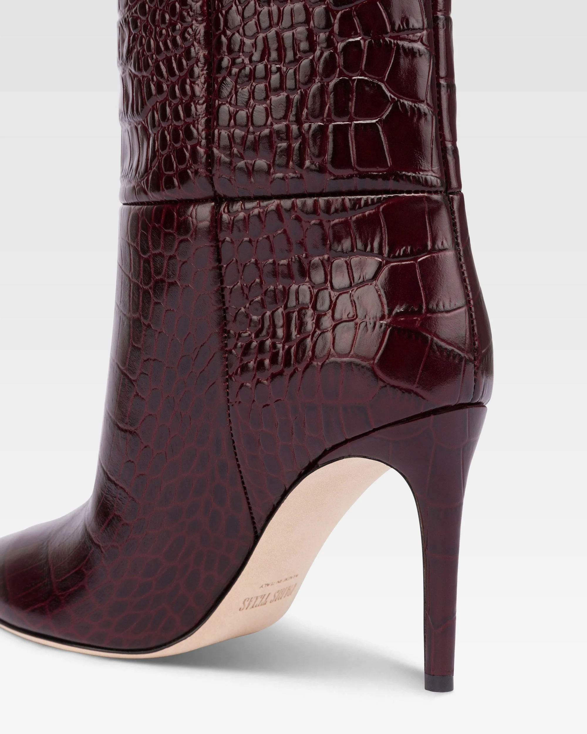 Pointed knee-high boots in rouge noir soft croco-embossed leather