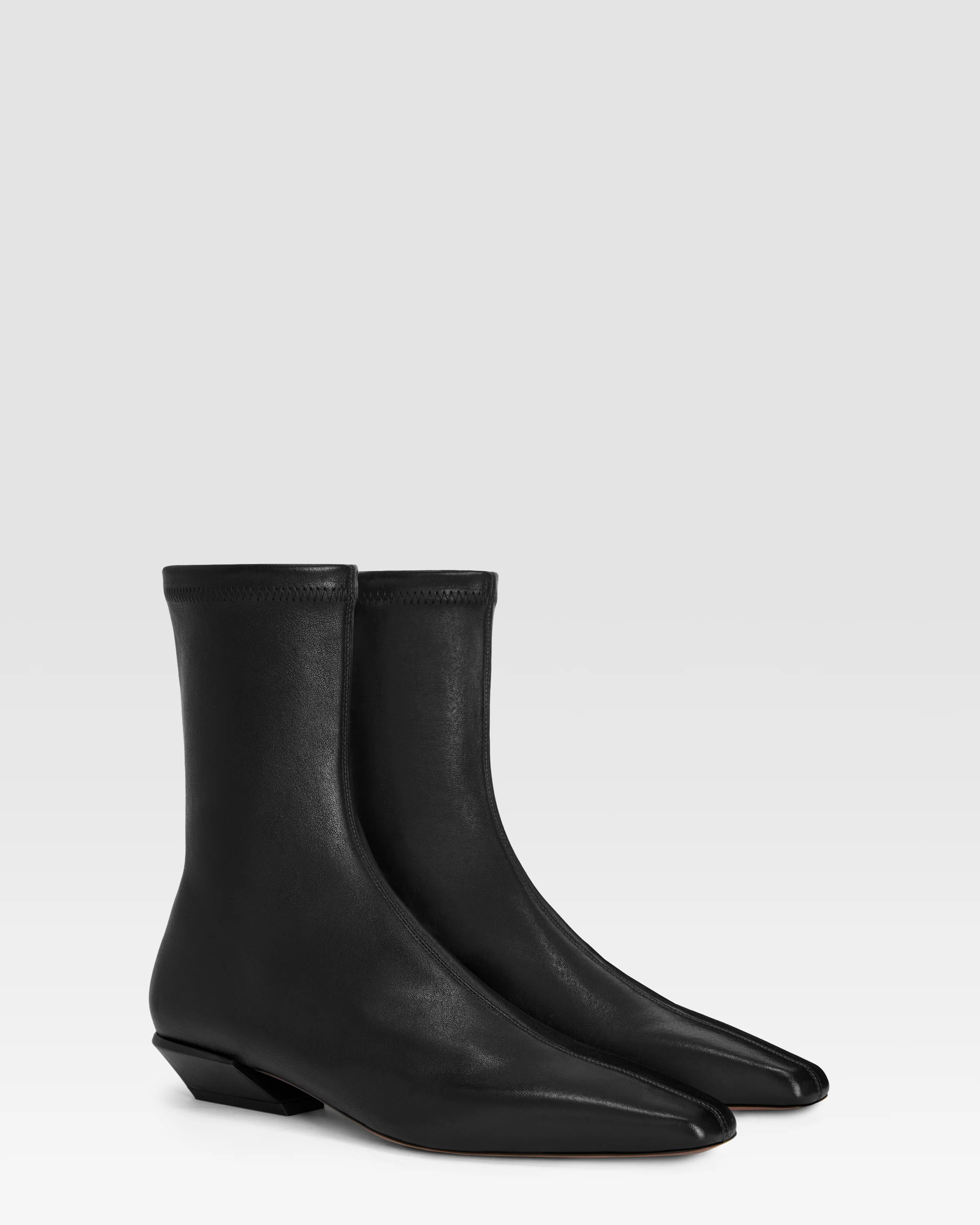 Ankle boots in black stretch leather
