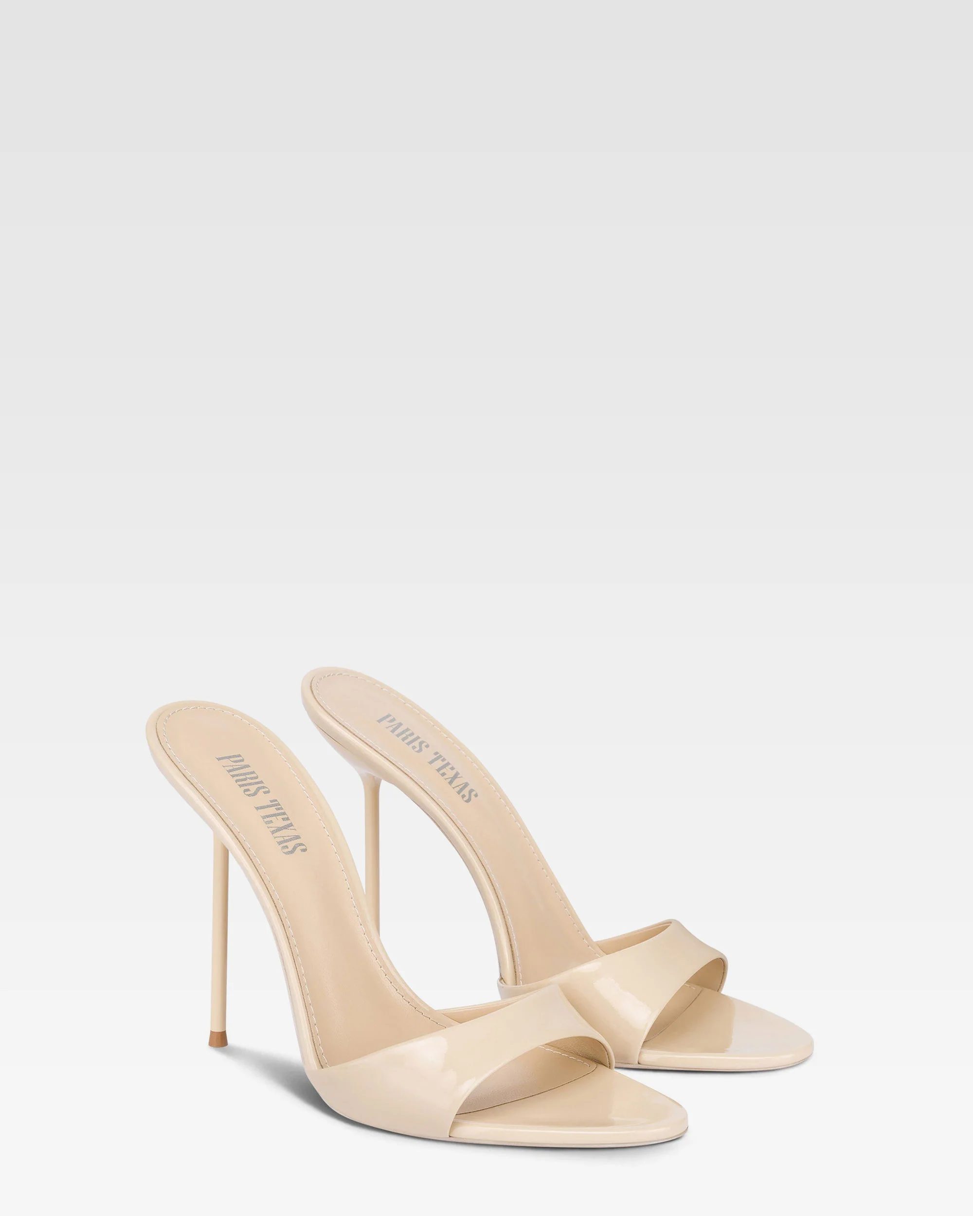 Mules in almond patent leather