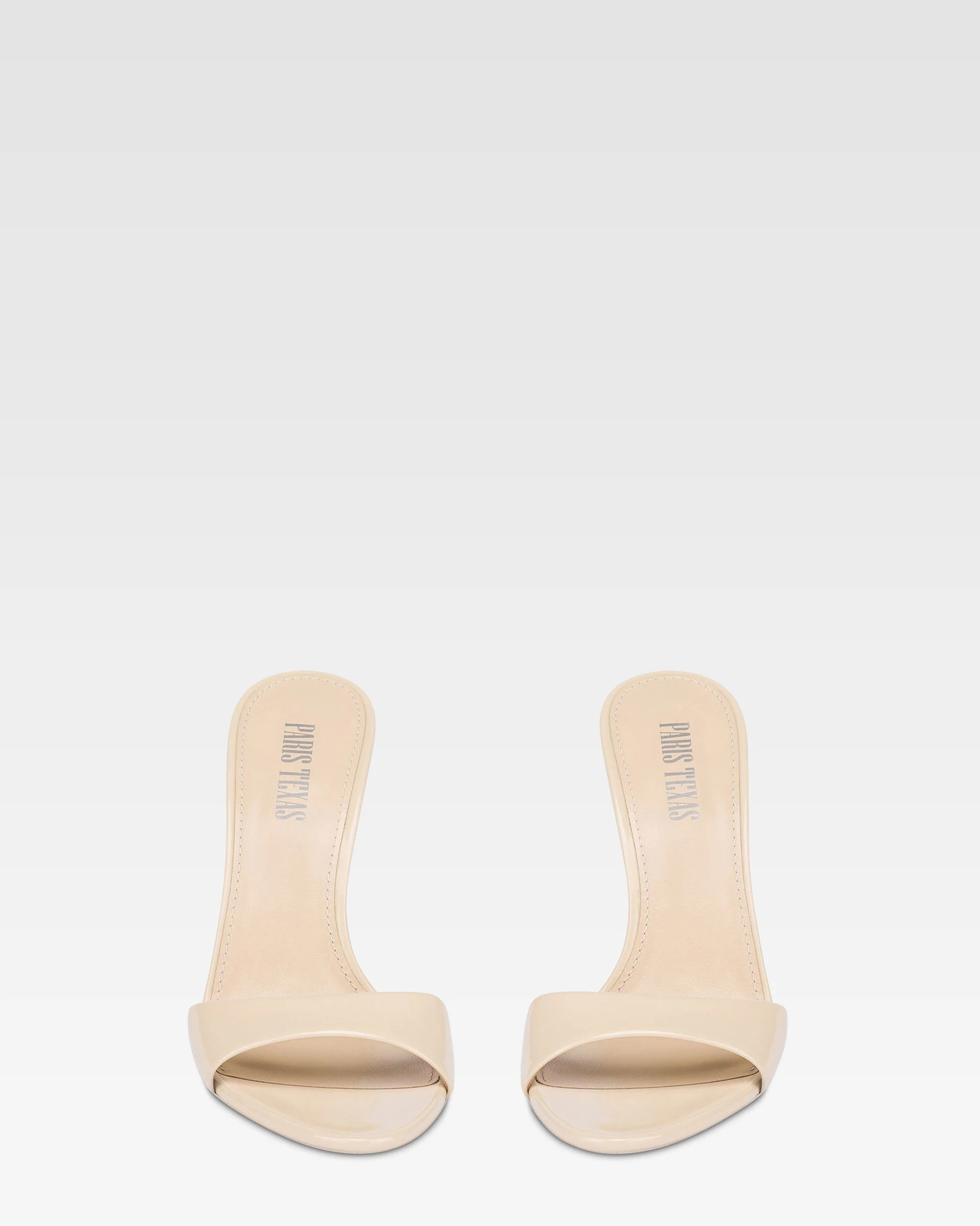 Mules in almond patent leather