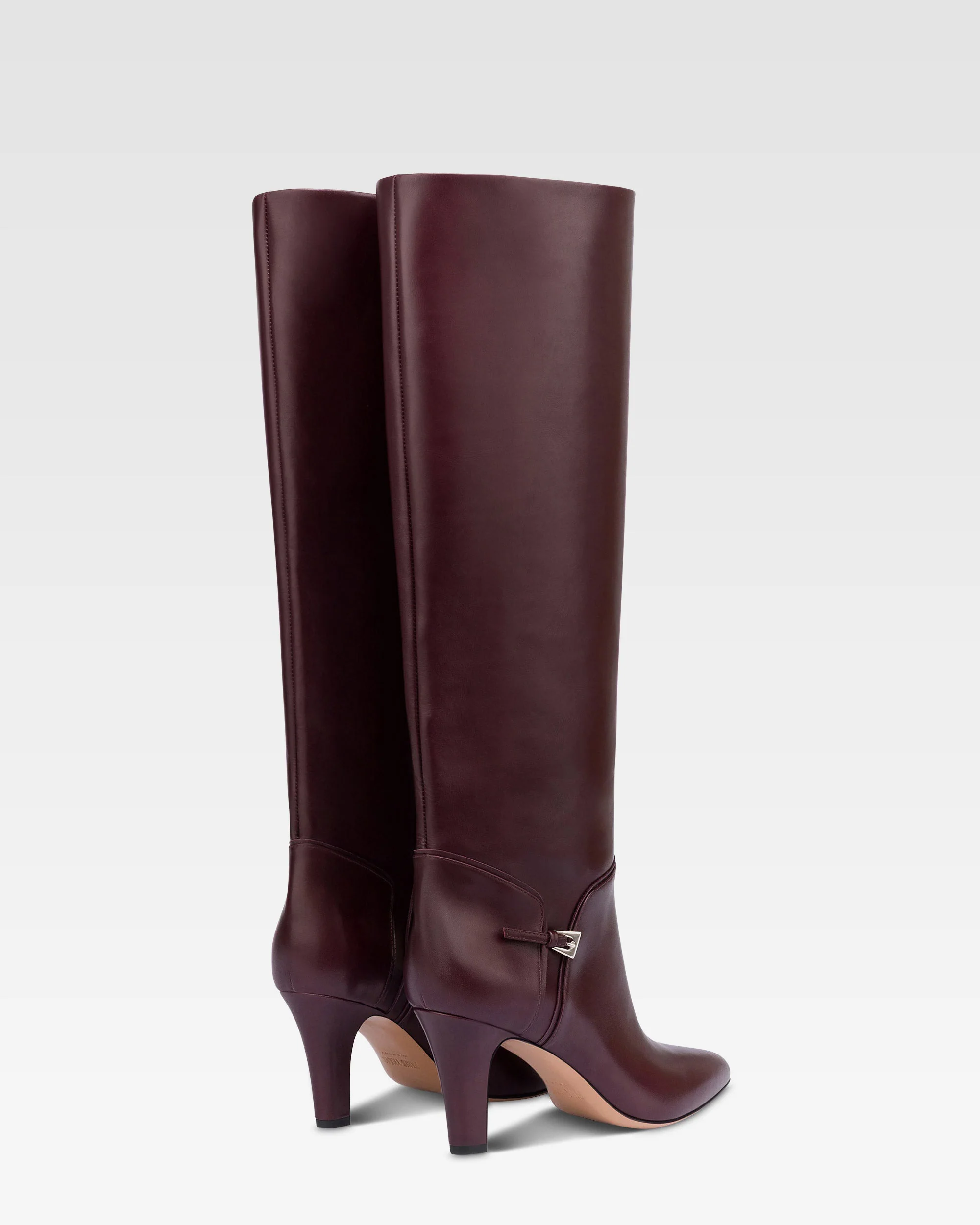 Boots in pinot noir calf leather. 3 Boots in pinot noir calf leather.