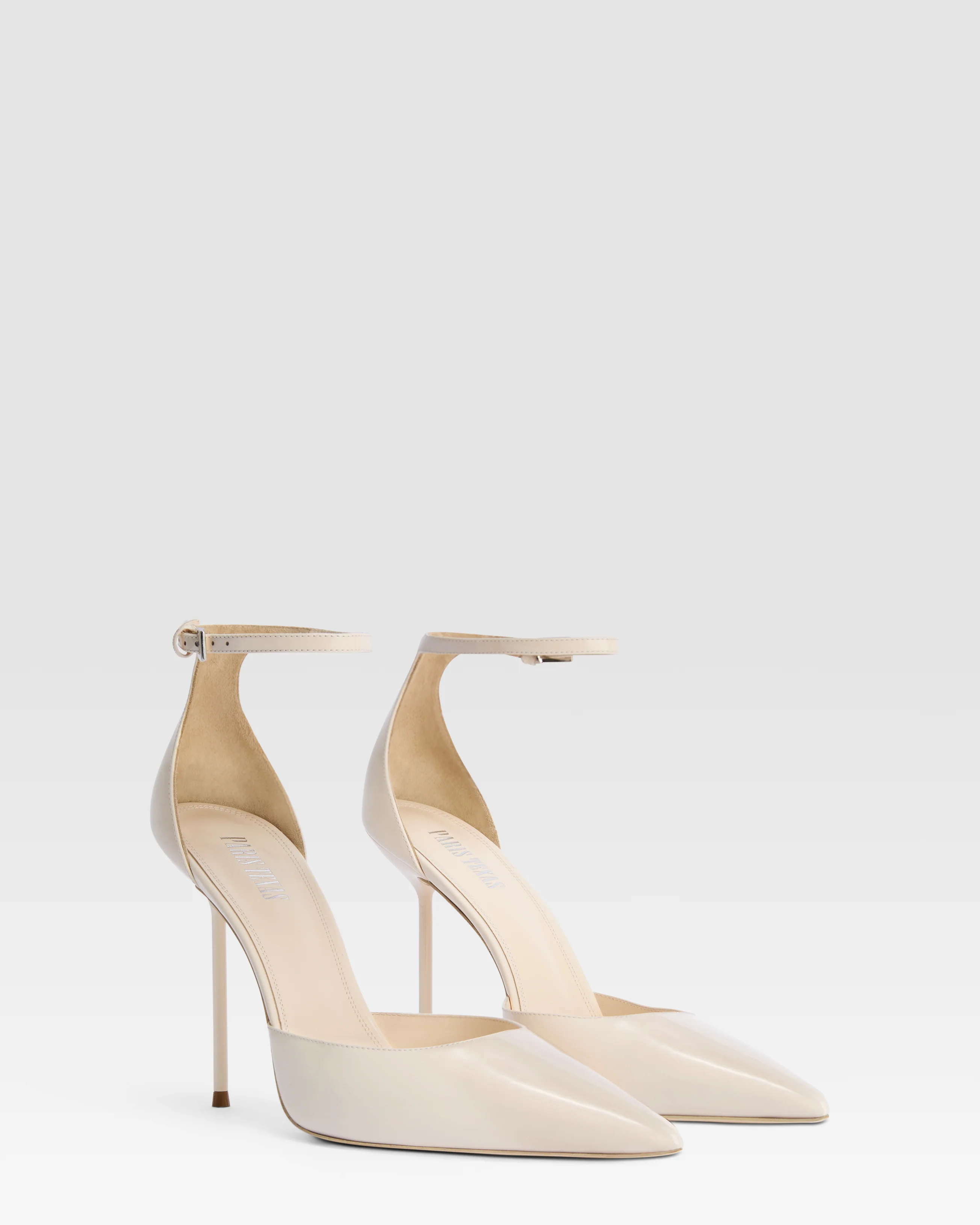 Ankle-strap pumps in ivory patent leather