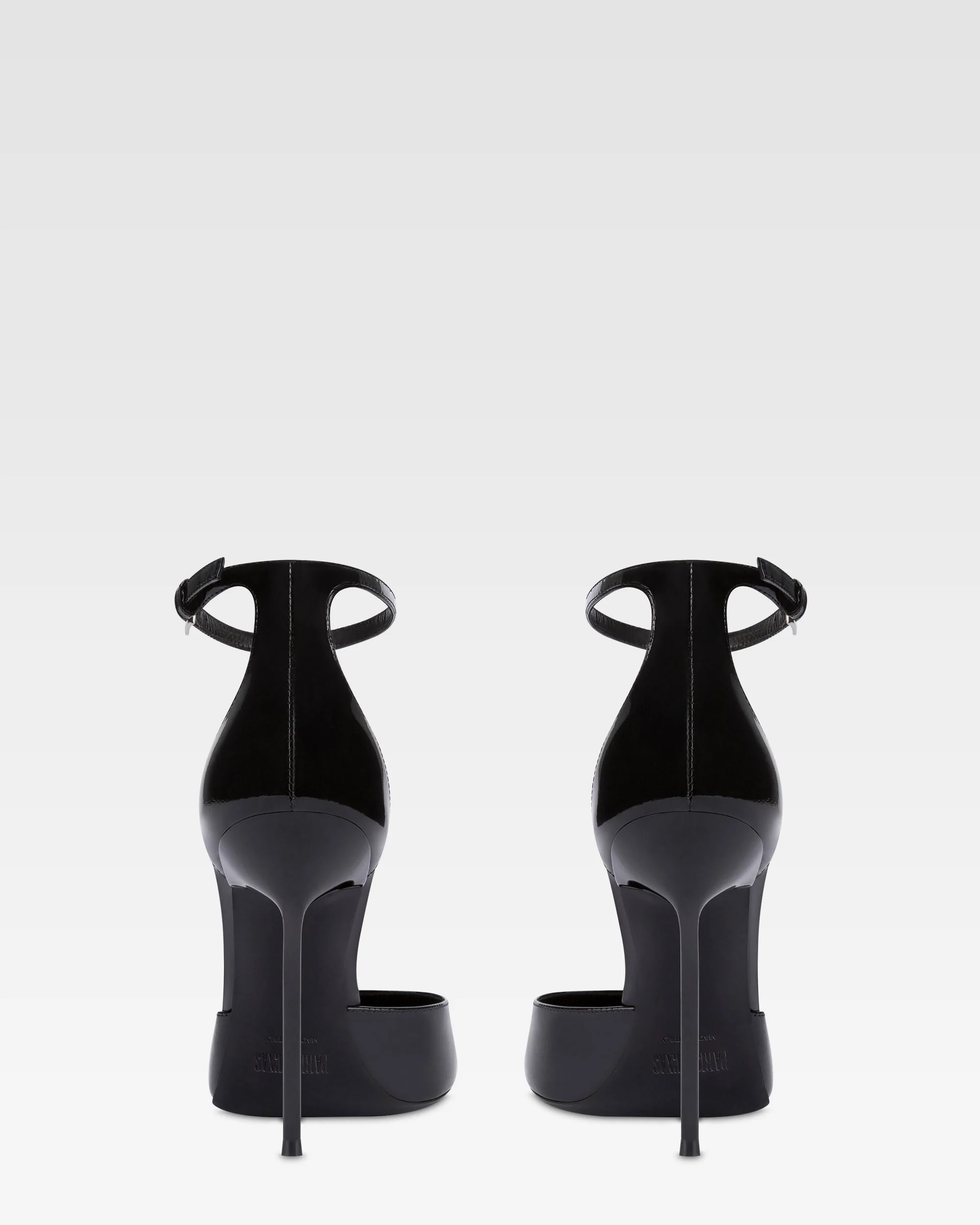 Ankle-strap pumps in black patent leather