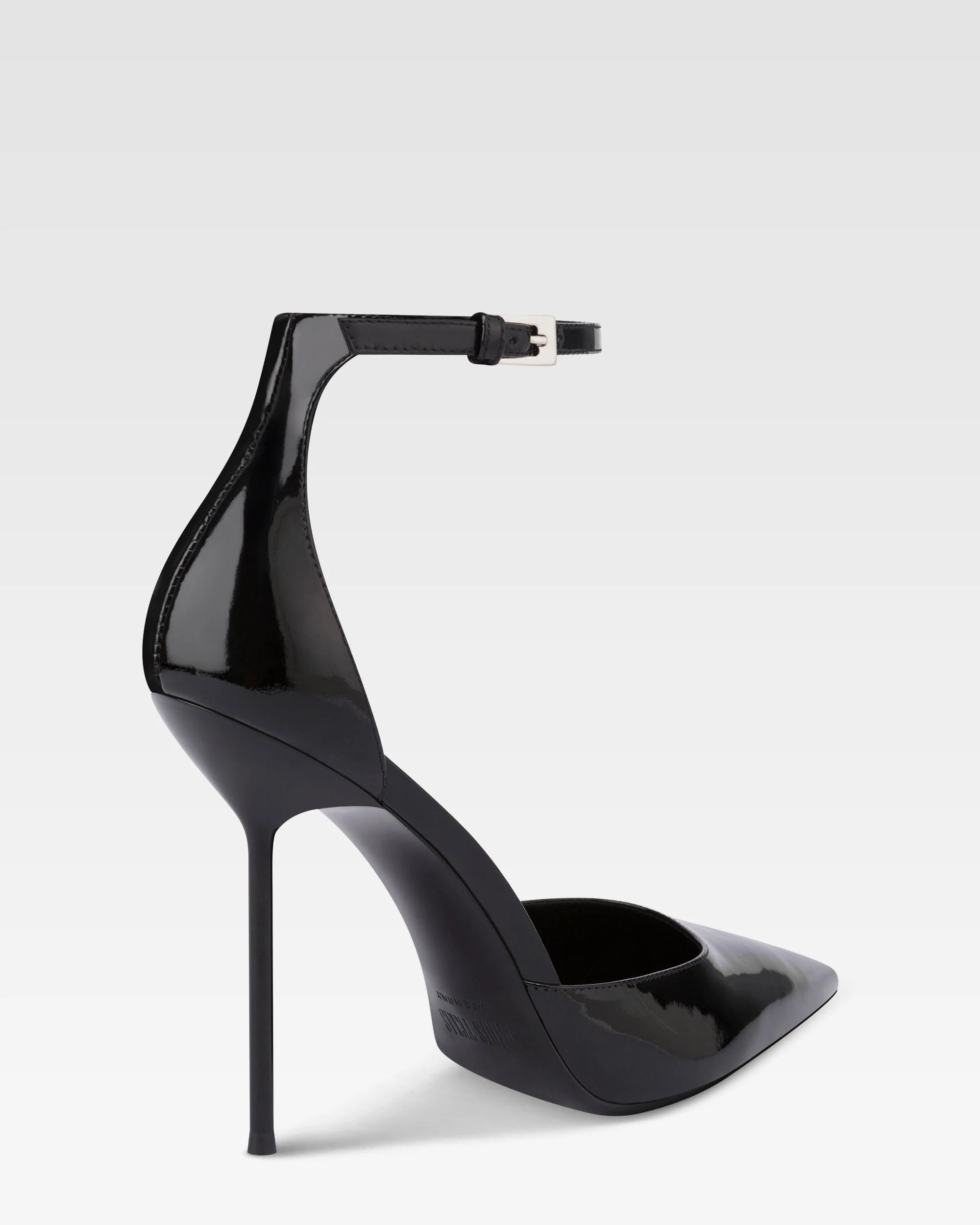Ankle-strap pumps in black patent leather