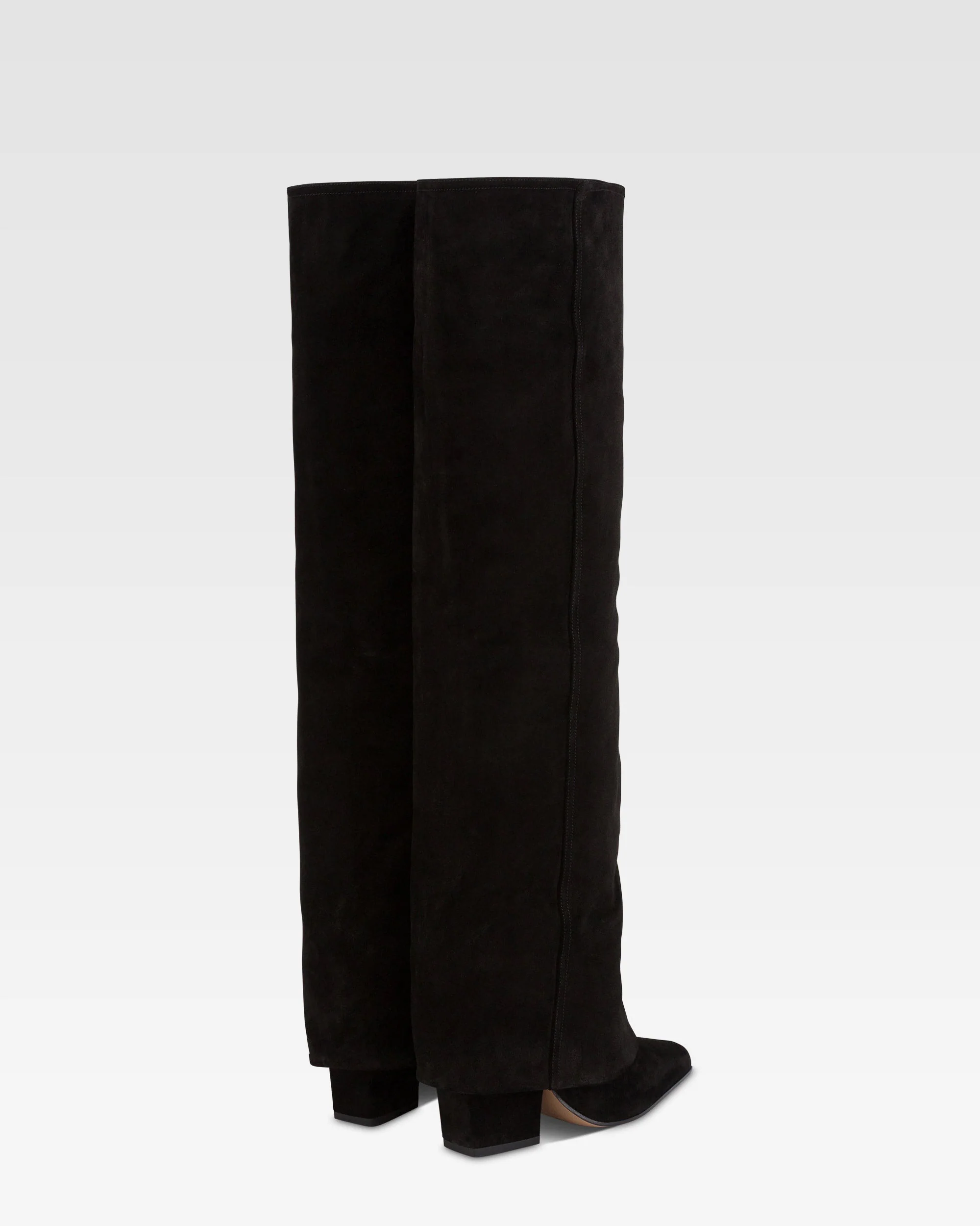 Fold-over boots in black calf suede leather. 3 Fold-over boots in black calf suede leather.