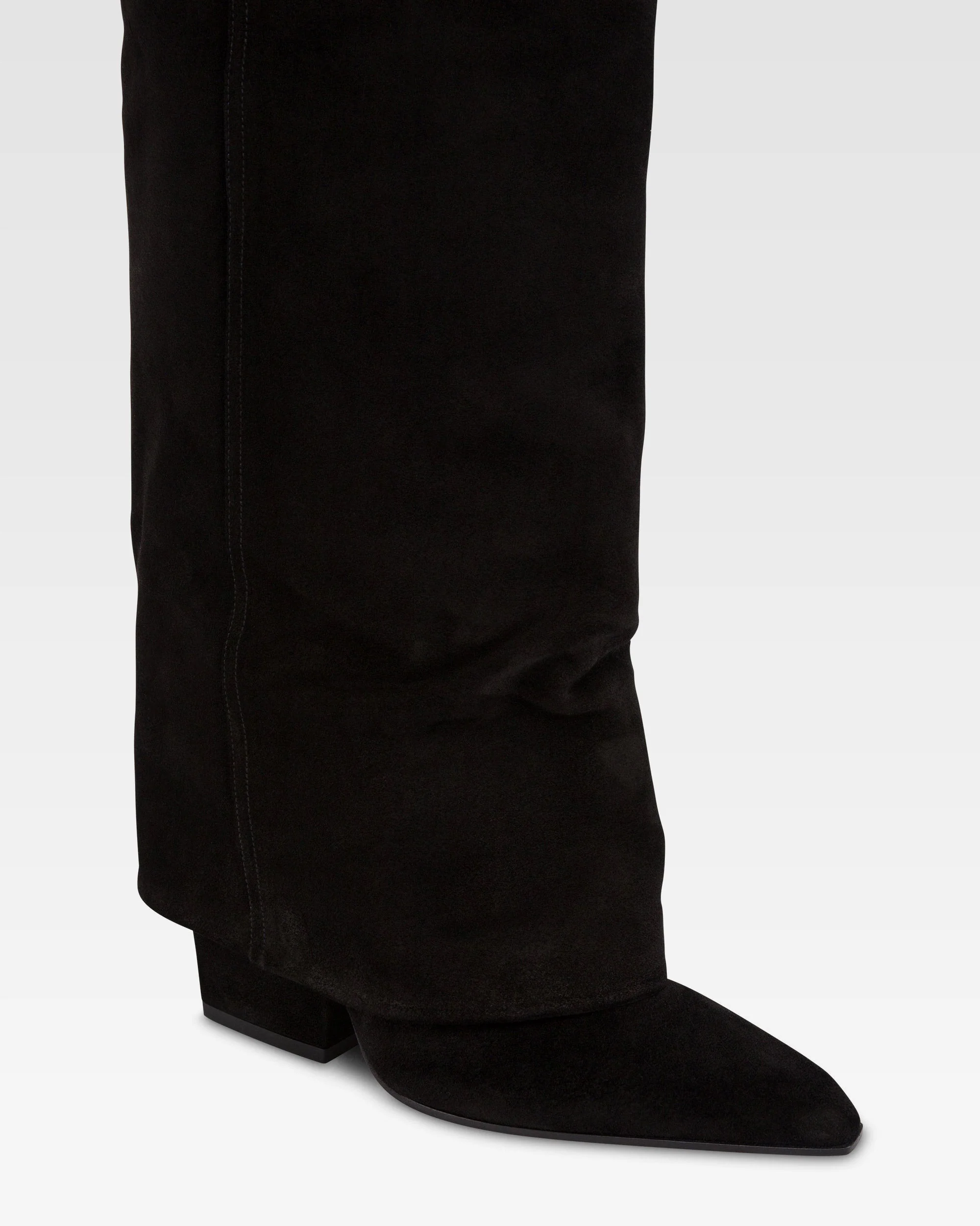 Fold-over boots in black calf suede leather. 5 Fold-over boots in black calf suede leather.
