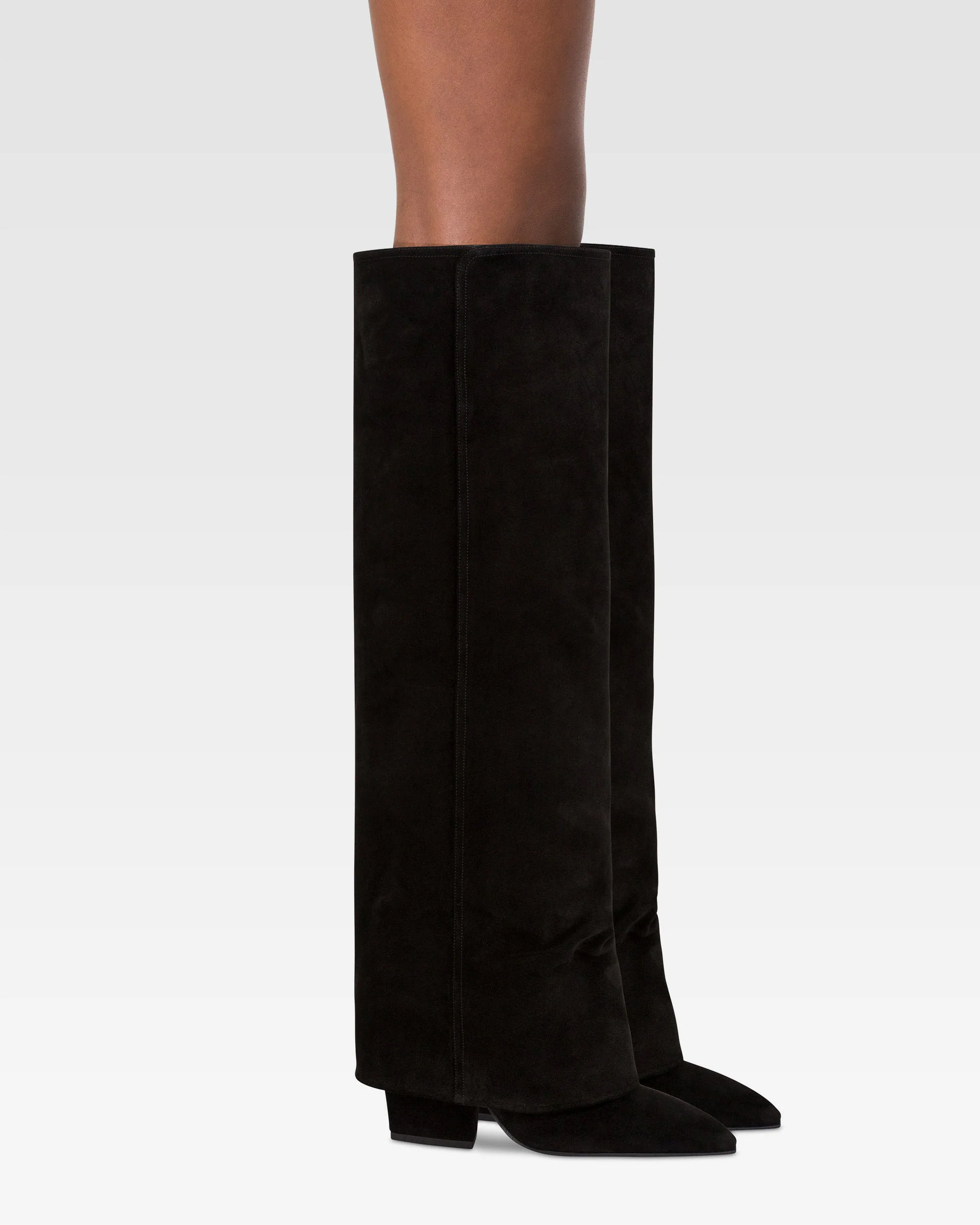 Fold-over boots in black calf suede leather. 6 Fold-over boots in black calf suede leather.
